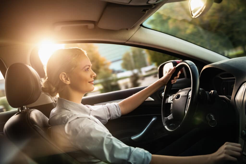 A Businesswoman in her car driving