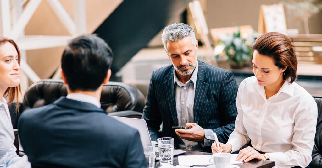 image of business people meeting, evoking customer-centric cfo