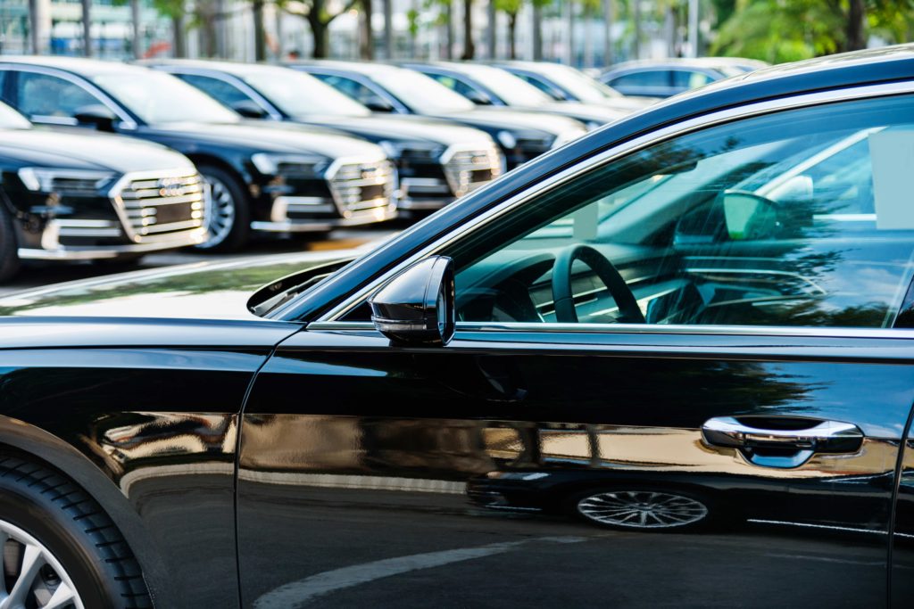 image of vehicles in a lot, evoking fleet prices