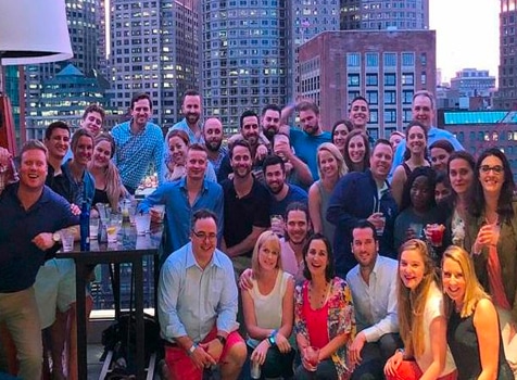 Large group of people in front of a cityscape