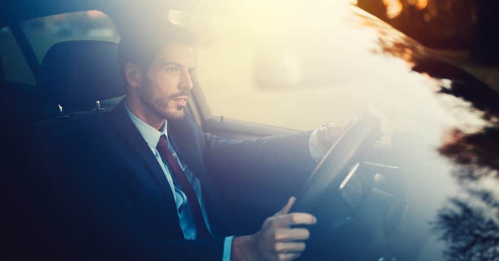 business man driving a car evoking IRS publication 463