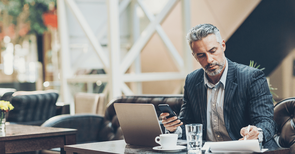 image of business man working in lobby evoking CFOs realize cost savings