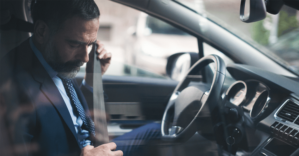 man buckling seatbelt evoking company driver safety program