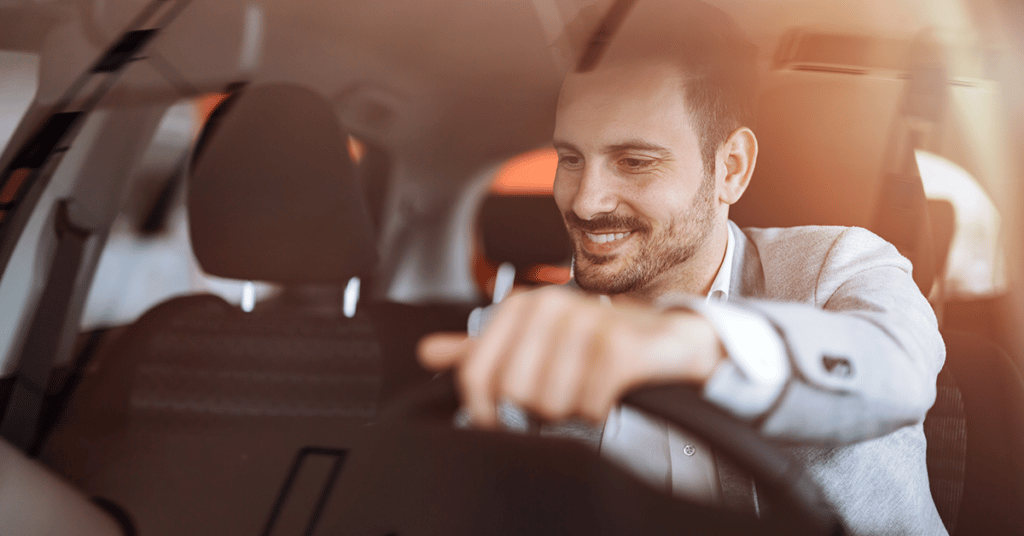 business man driving vehicle evoking Mobile Workforce Management Software