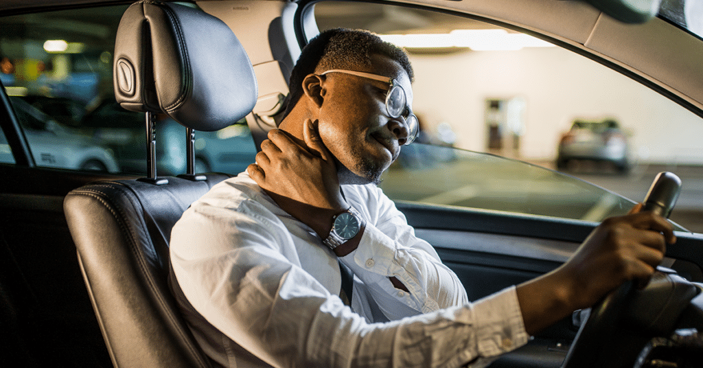 man in car with neck pain evoking relieve pain from driving
